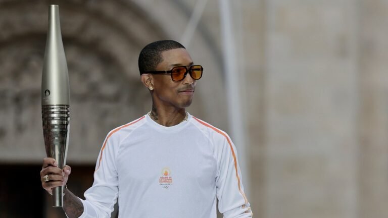 Pharrell Williams Carries Torch at Paris 2024 Olympics